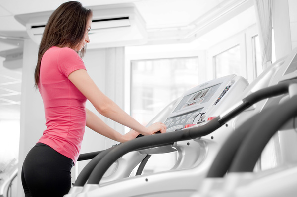 Treadmill on the girl Stock Photo