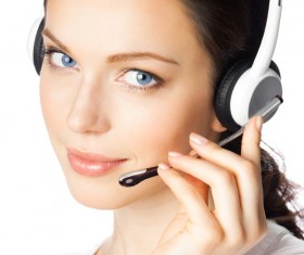 Wearing a headset business woman Stock Photo