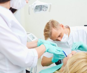 dentist who treats teeth Stock Photo