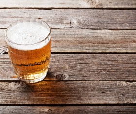 glass of beer on a wooden table Stock Photo