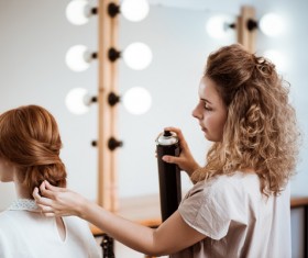 hairdresser who takes care of the hair for the customer Stock Photo 02