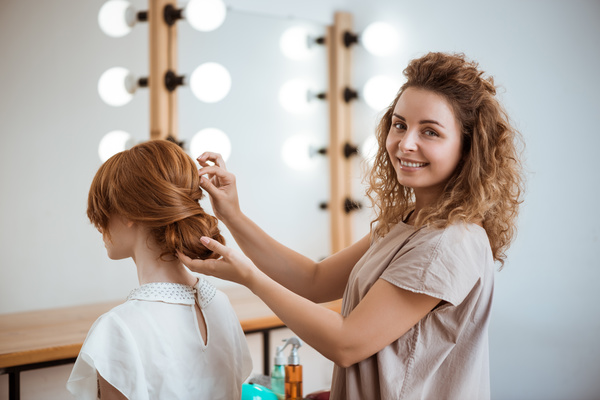 hairdresser who takes care of the hair for the customer Stock Photo 03