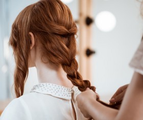 hairdresser who takes care of the hair for the customer Stock Photo 06