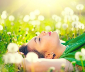 woman lying in a grass Stock Photo