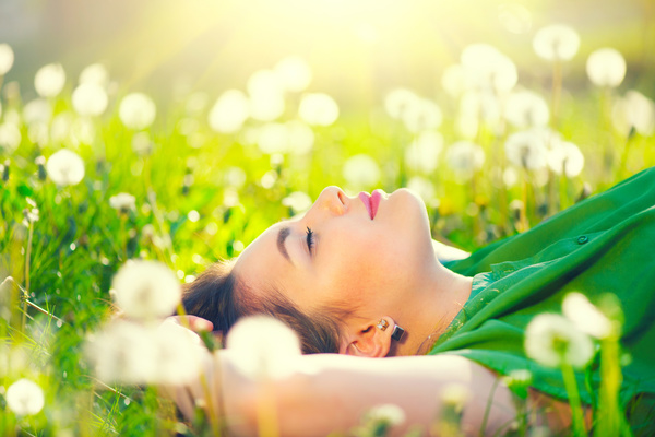 woman lying in a grass Stock Photo