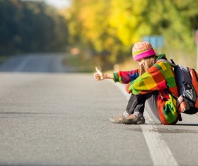 woman on a roadside free ride Stock Photo