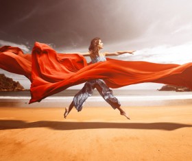 woman who dances red silk on the beach HD picture