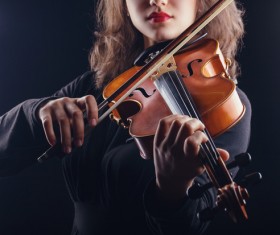 woman who plays the violin Stock Photo
