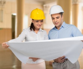 Architects look at drawings Stock Photo