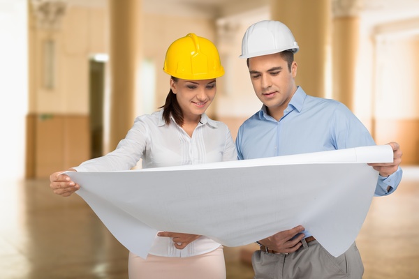 Architects look at drawings Stock Photo