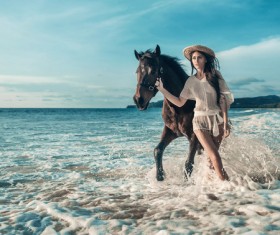 Beach woman walking horse HD picture