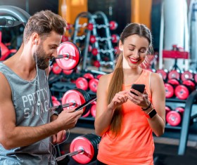 Chatting men and women in the gym Stock Photo