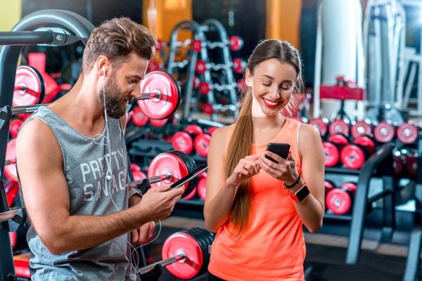 Chatting men and women in the gym Stock Photo