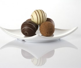 Chocolate candy on white plate Stock Photo
