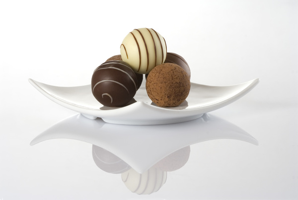 Chocolate candy on white plate Stock Photo