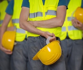 Construction worker holding a helmet