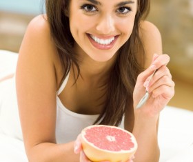 Eat fruit woman Stock Photo
