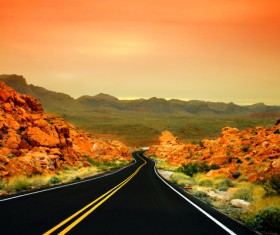 Extended road and roadside hills Stock Photo