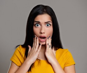 Eyes widened woman Stock Photo