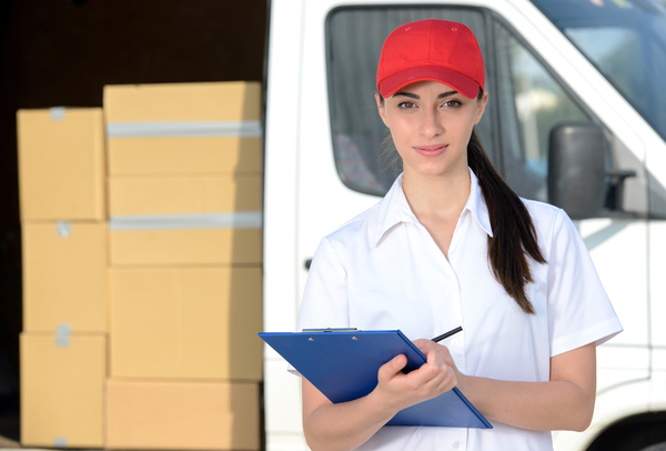 Female courier delivery staff Stock Photo