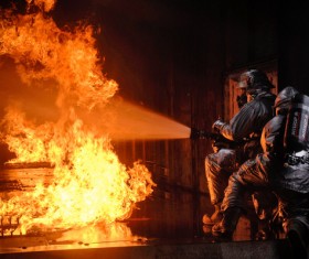 Firefighters fire fighting Stock Photo