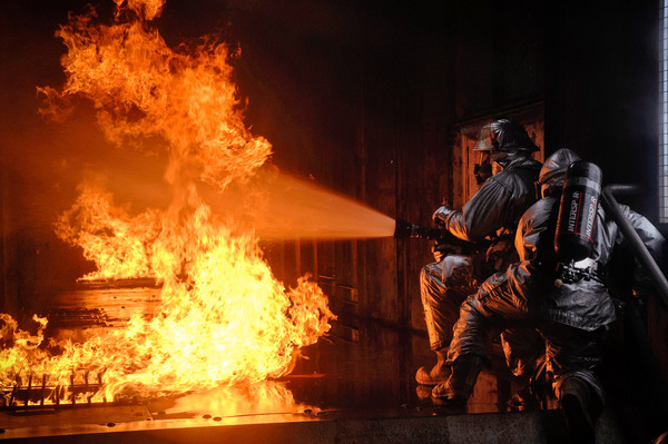 Firefighters fire fighting Stock Photo