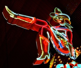 Girl lights signboard Stock Photo