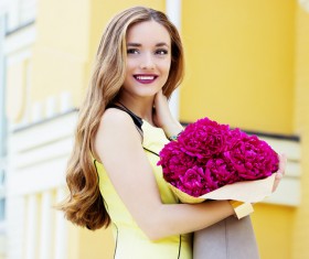 Holding the flowers girl Stock Photo