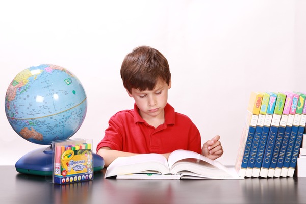 Learn to read the boy alone Stock Photo