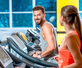 On a treadmill workout girl with coach Stock Photo 01