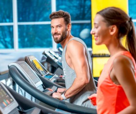 On a treadmill workout girl with coach Stock Photo 02