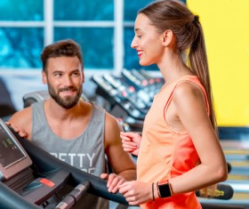 On a treadmill workout girl with coach Stock Photo 03