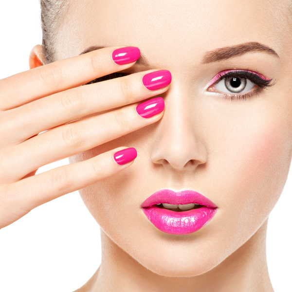 eautiful woman face with pink makeup of eyes and nails. free download