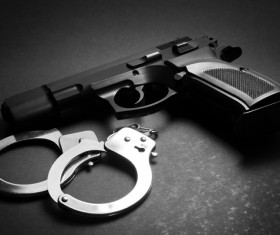 Pistols and handcuffs Stock Photo