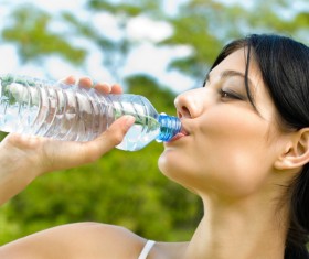 Rehydrate after exercise woman Stock Photo