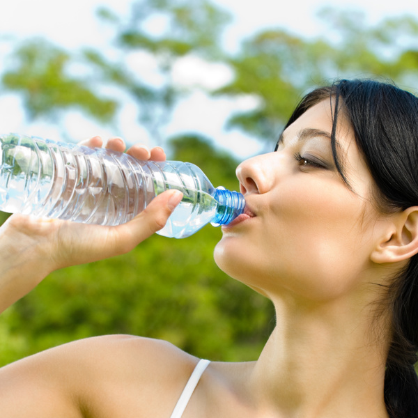 Rehydrate after exercise woman Stock Photo