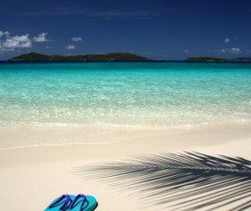 Slippers on the beach Stock Photo