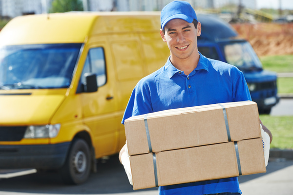 Smiling express courier Stock Photo
