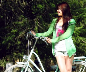 Smiling girl with bike Stock Photo