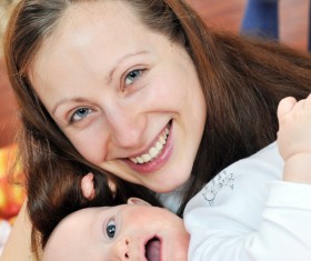 Smiling mother with baby Stock Photo 01