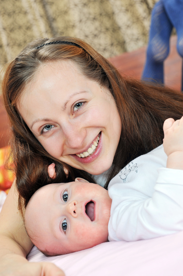 Smiling mother with baby Stock Photo 01