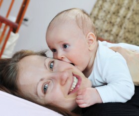 Smiling mother with baby Stock Photo 02