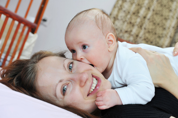 Smiling mother with baby Stock Photo 02