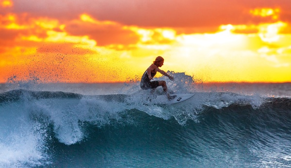 Surfing man Stock Photo