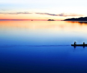 The boat on the lake in the evening Stock Photo