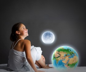 The little girl with the earth moon Stock Photo
