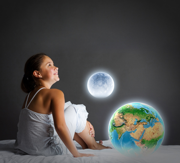 The little girl with the earth moon Stock Photo