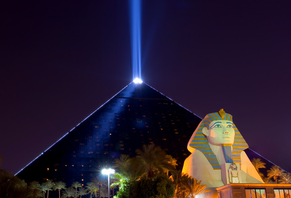 The modern pyramid of light technology and the Sphinx Stock Photo