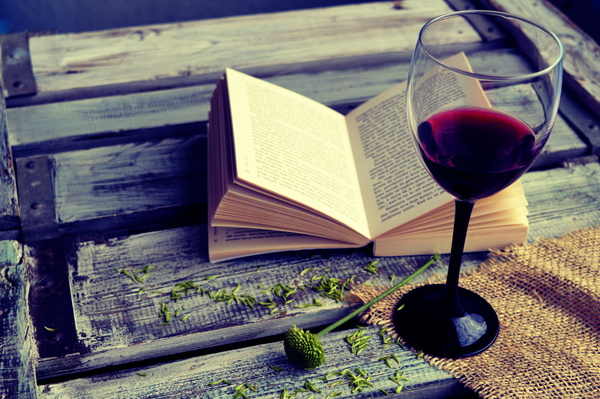 Wine and open book Stock Photo
