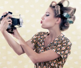 With the camera self-timer woman Stock Photo